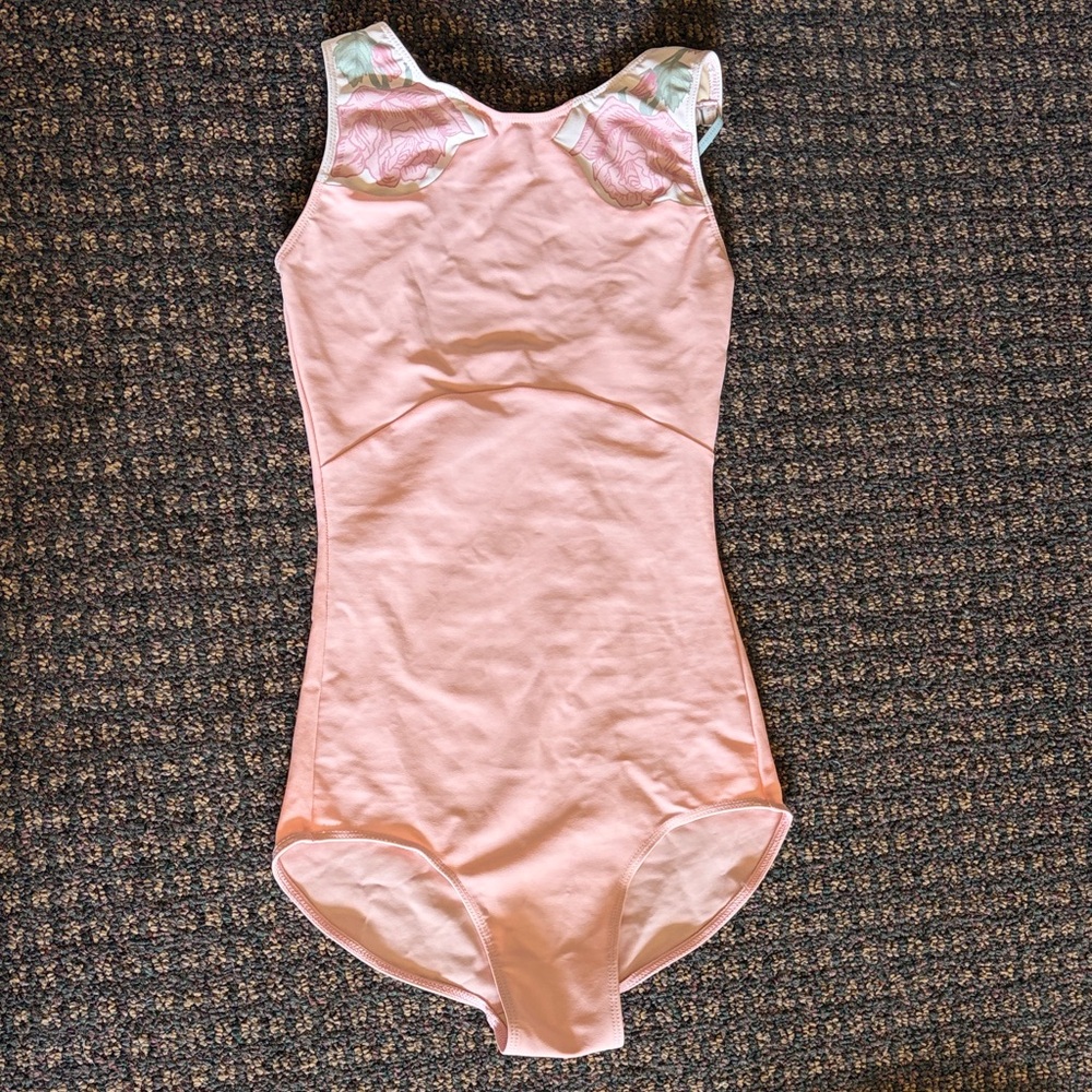Pink tank leotard with rose insets and adjustable straps